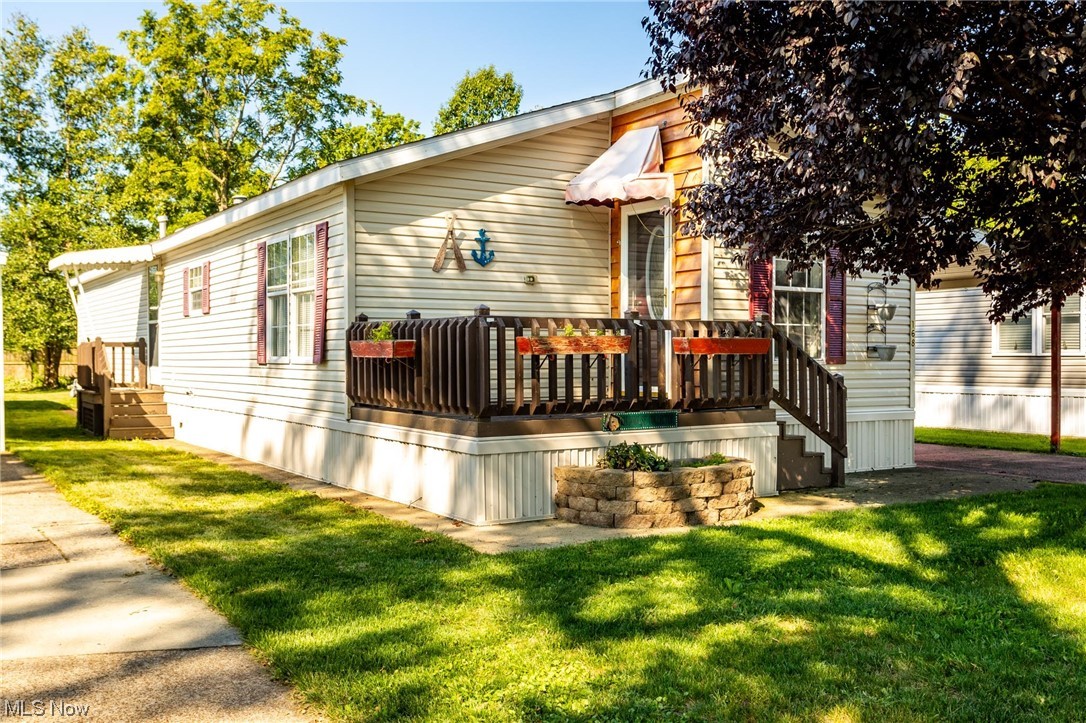 168 Coen Road Vermilion, OH 44089 - Photo 1 of 29 Back of house with a yard