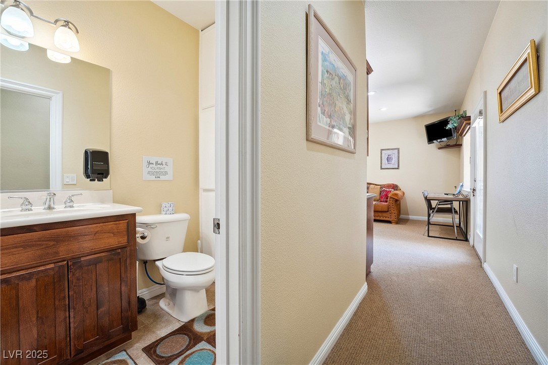 2181 Winery Road Pahrump, NV 89048 - Photo 49 of 73 Guest quarters half bath with built in cabinets.