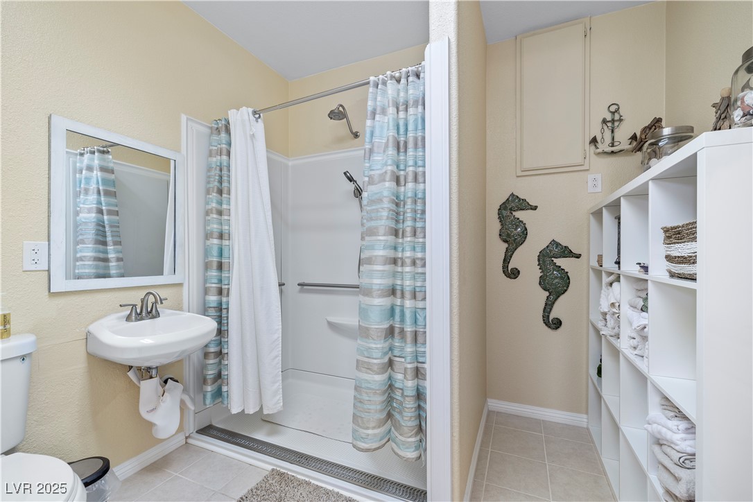2181 Winery Road Pahrump, NV 89048 - Photo 53 of 73 Handicap Shower, Sink and Toilet in the Guest Quarters with shelving that can stay or go to the right. Water panel located in this bathroom.