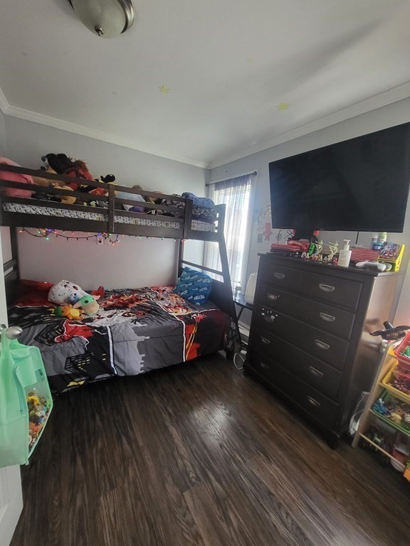 28 Frederick Street New Bedford, MA 02744 - Photo 12 of 29 a bed room with a bed and a flat screen tv