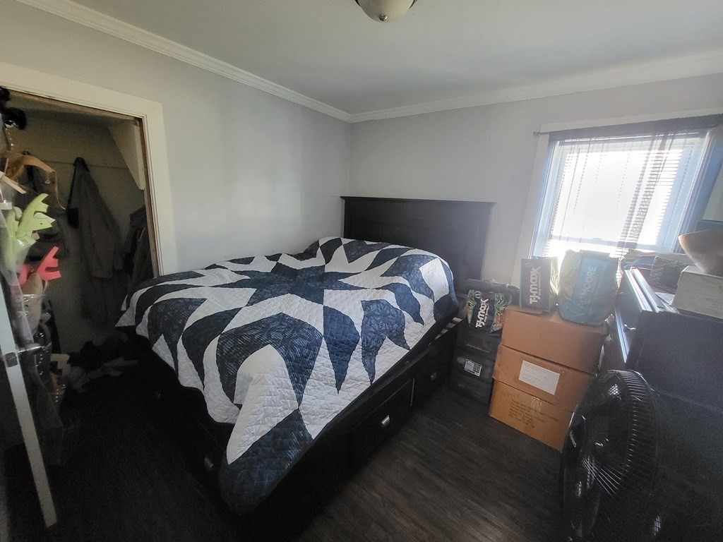 28 Frederick Street New Bedford, MA 02744 - Photo 13 of 29 a bedroom with a bed and window