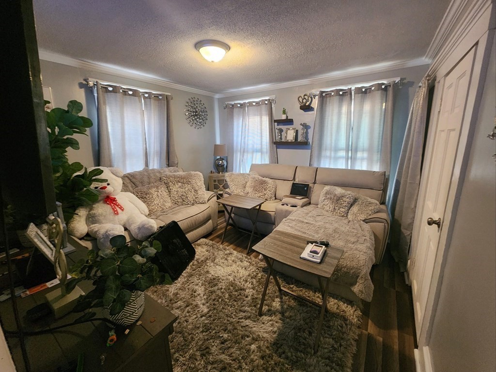 28 Frederick Street New Bedford, MA 02744 - Photo 16 of 29 a bedroom with bed and a window