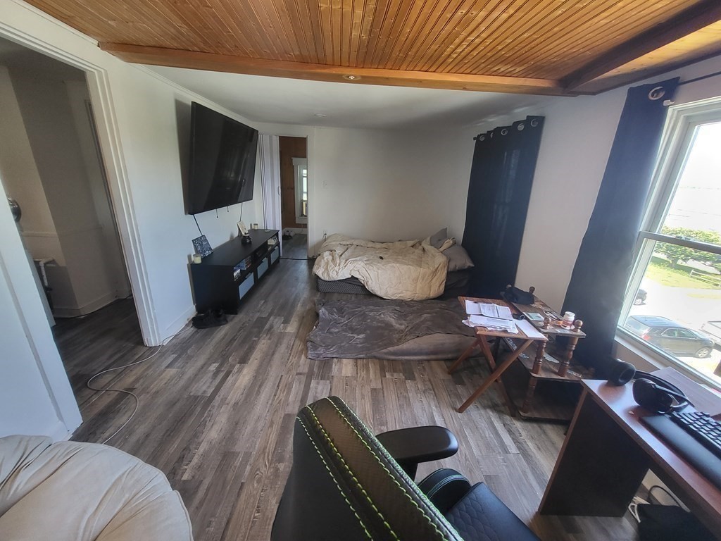 28 Frederick Street New Bedford, MA 02744 - Photo 22 of 29 a living room with furniture and a flat screen tv