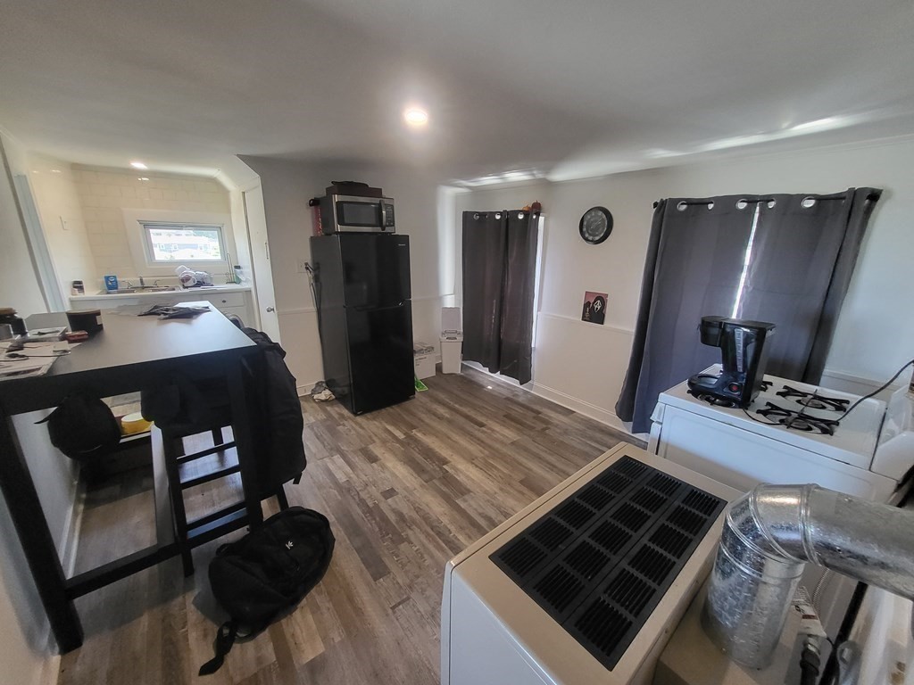 28 Frederick Street New Bedford, MA 02744 - Photo 26 of 29 a bed room with a bed furniture and a flat screen tv