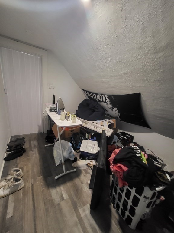 28 Frederick Street New Bedford, MA 02744 - Photo 28 of 29 a bedroom with a bed and a window