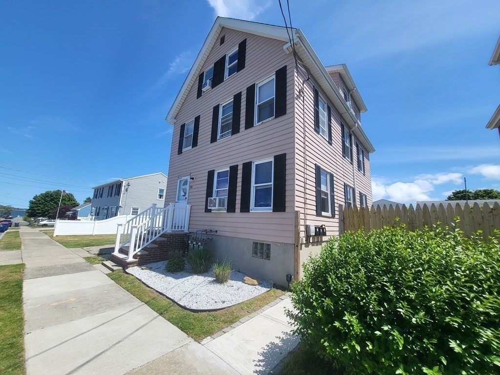 28 Frederick Street New Bedford, MA 02744 - Photo 3 of 29 a front view of a house with garden and sitting area