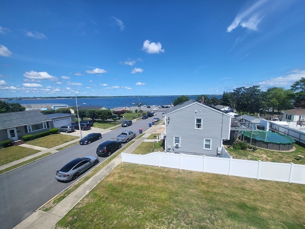 28 Frederick Street New Bedford, MA 02744 - Photo 7 of 29 a view of a swimming pool with a lawn chairs and a fire pit