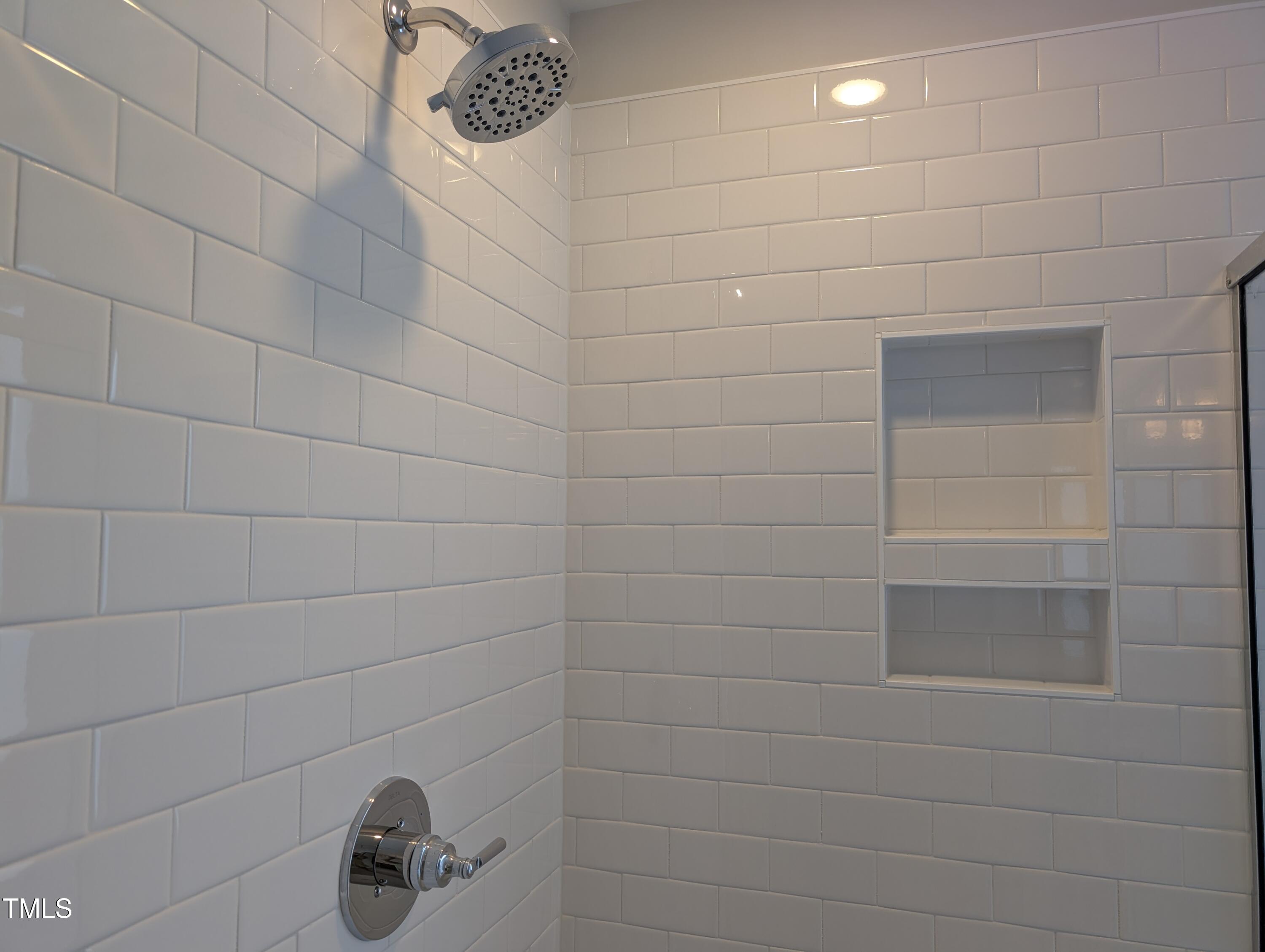 9224 Leaning Post Road, Unit 445 Wake Forest, NC 27587 - Photo 21 of 28 Tiled Walk-In Shower w/Inset Storage