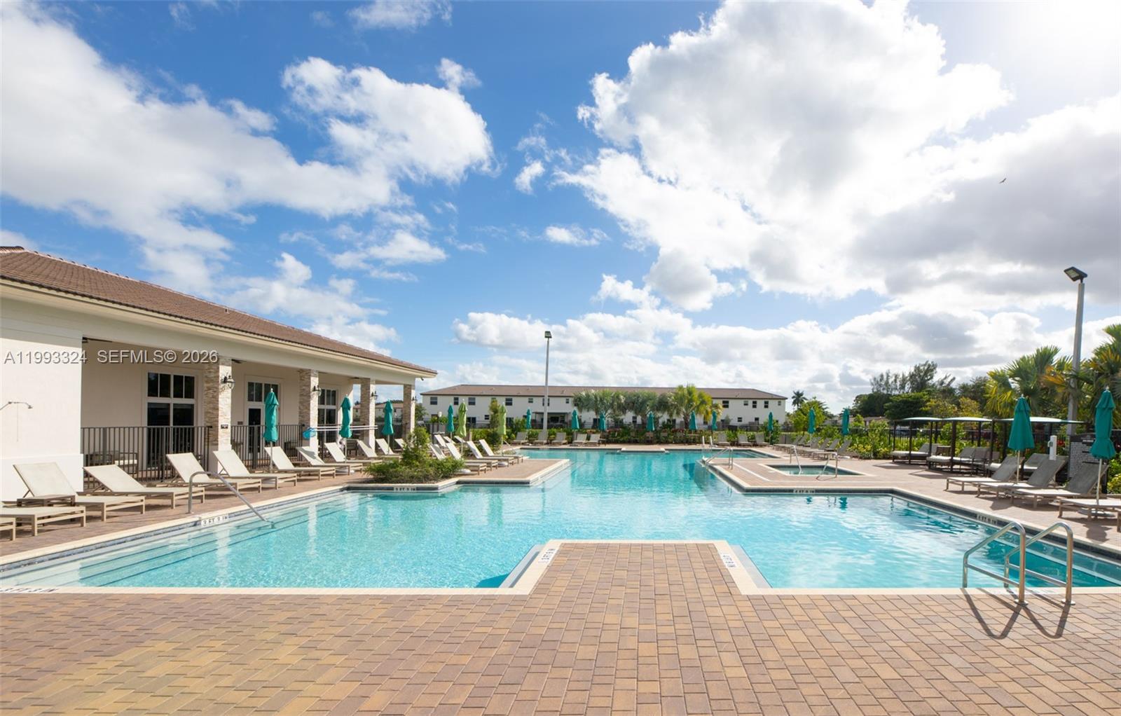 12604 Northwest 23rd Place Miami, FL 33167 - Photo 35 of 39 a view of a swimming pool and lounge chair