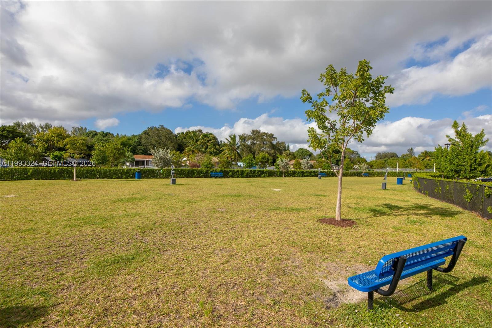 12604 Northwest 23rd Place Miami, FL 33167 - Photo 37 of 39 a view of a lake with a yard