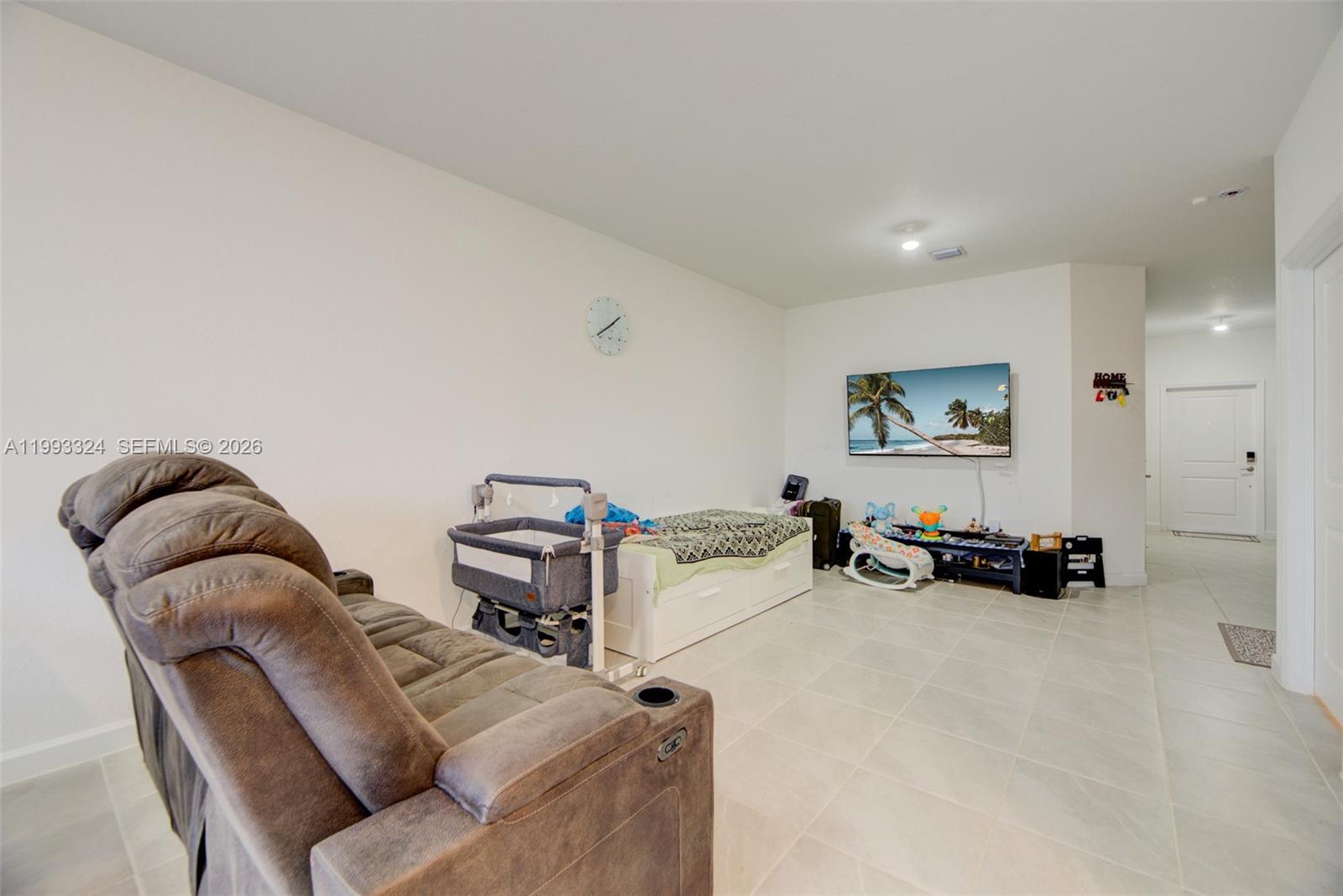 12604 Northwest 23rd Place Miami, FL 33167 - Photo 8 of 39 a living room with furniture