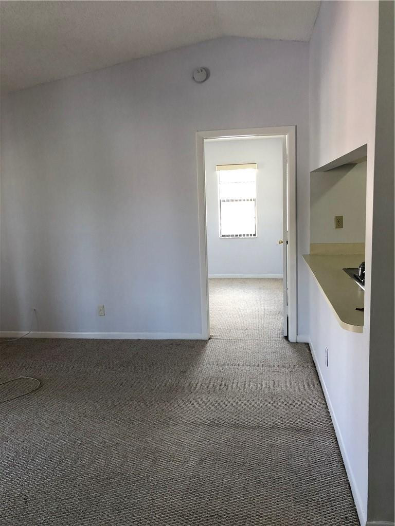 9466 Boca Cove Circle, Unit 313 Boca Raton, FL 33428 - Photo 5 of 7 a view of an empty room and window