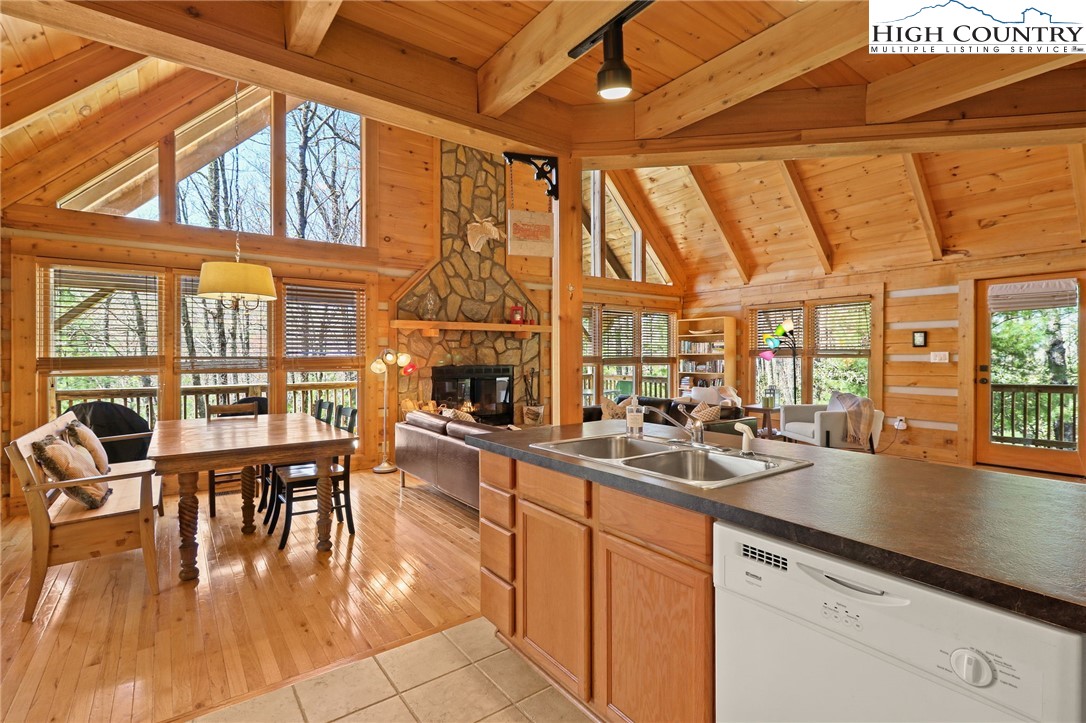 291 Dream Forest Path Banner Elk, NC 28604 - Photo 19 of 43 a kitchen with stainless steel appliances granite countertop a stove and cabinets with wooden floor