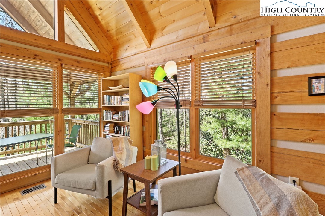 291 Dream Forest Path Banner Elk, NC 28604 - Photo 20 of 43 a living room with furniture and a large window