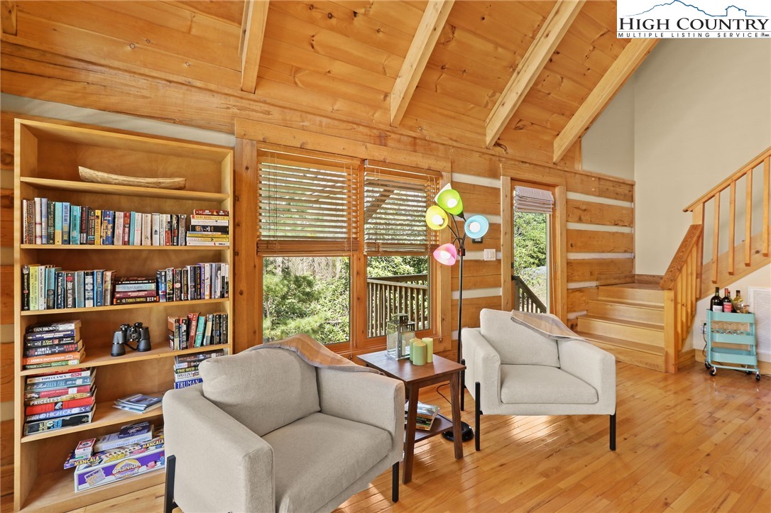 291 Dream Forest Path Banner Elk, NC 28604 - Photo 21 of 43 a living room with furniture and a book shelf