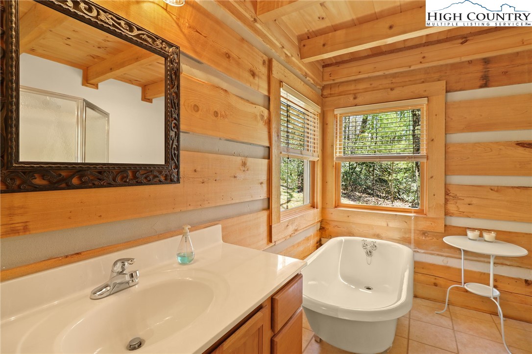 291 Dream Forest Path Banner Elk, NC 28604 - Photo 24 of 43 a bathroom with a sink and a bathtub
