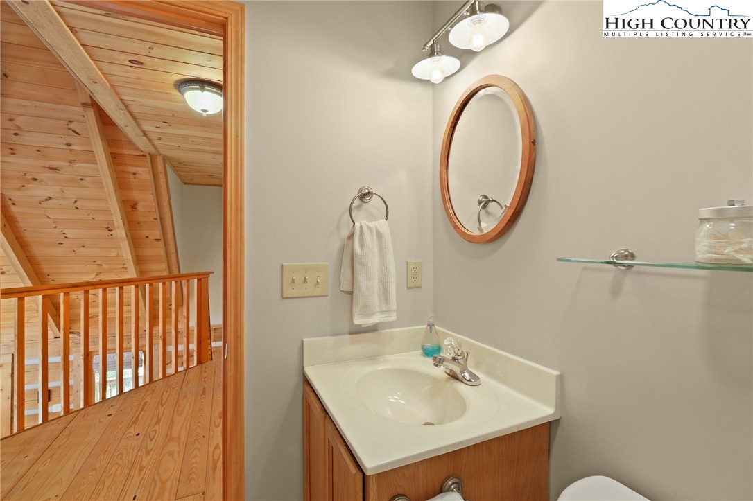 291 Dream Forest Path Banner Elk, NC 28604 - Photo 34 of 43 a bathroom with a sink and a mirror