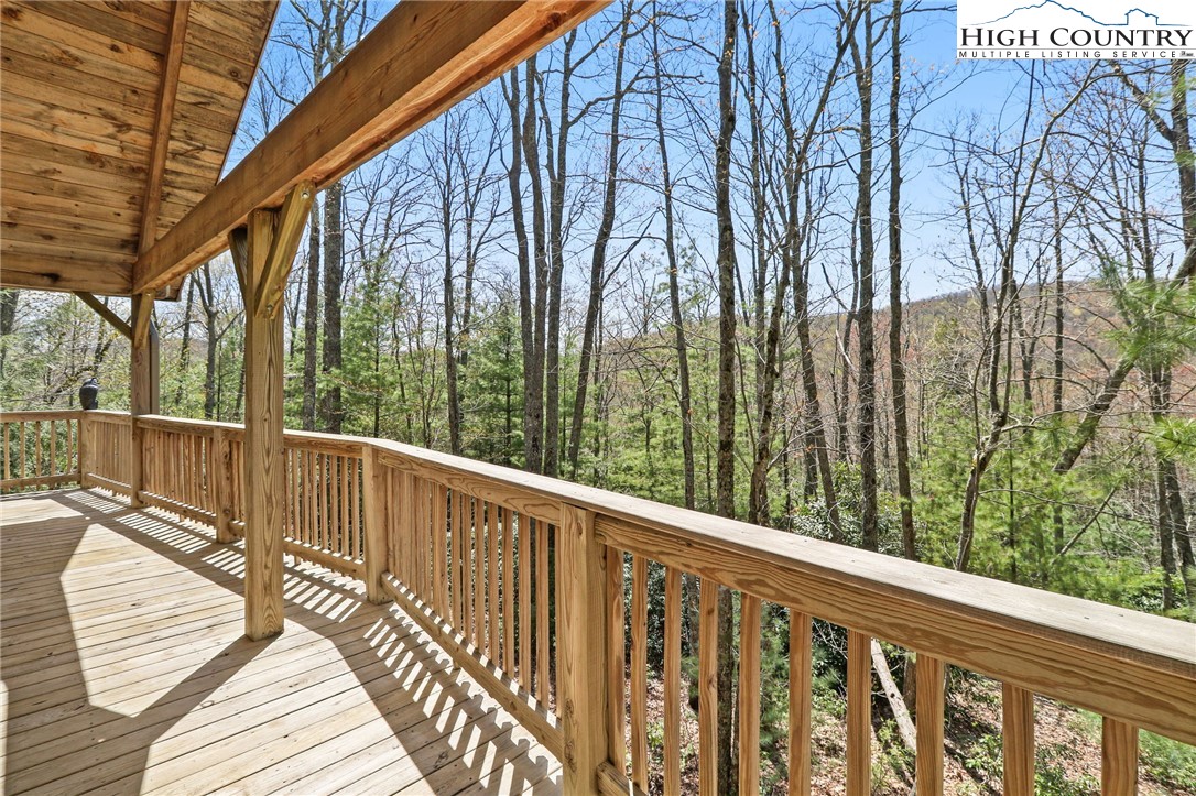 291 Dream Forest Path Banner Elk, NC 28604 - Photo 39 of 43 a view of balcony with wooden floor and fence
