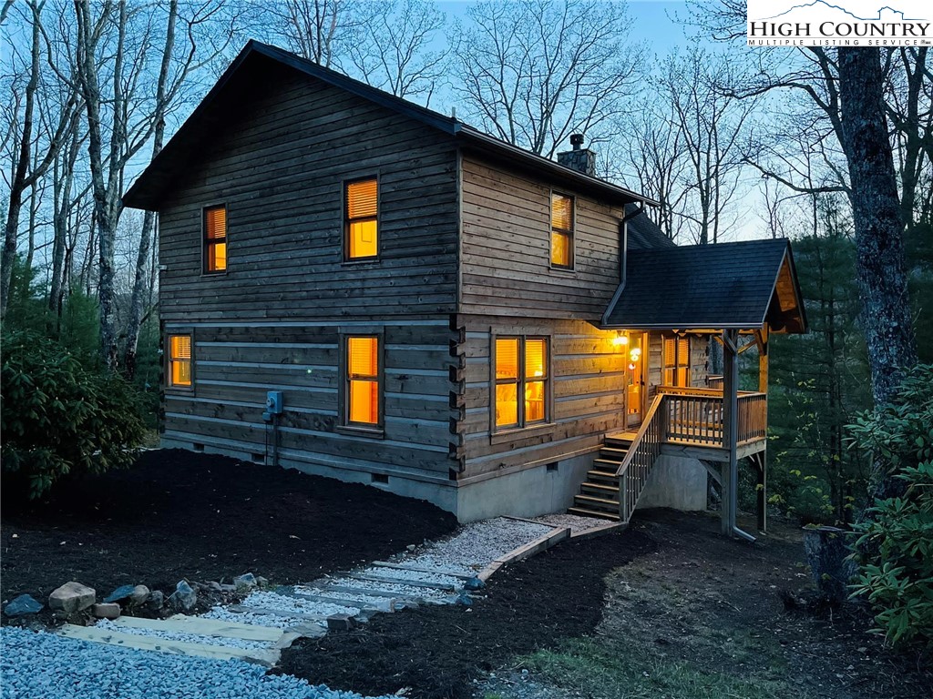 291 Dream Forest Path Banner Elk, NC 28604 - Photo 4 of 43 a view of house with backyard and trees