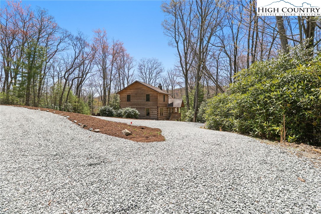 291 Dream Forest Path Banner Elk, NC 28604 - Photo 8 of 43 a view of a yard with large trees