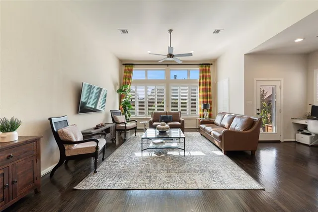 a large white kitchen with a large island oven a stove a sink and a refrigerator