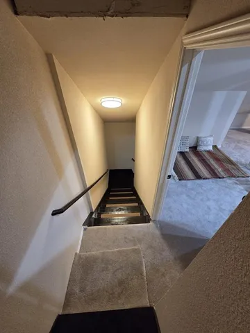 a bathroom with a sink mirror toilet and shower