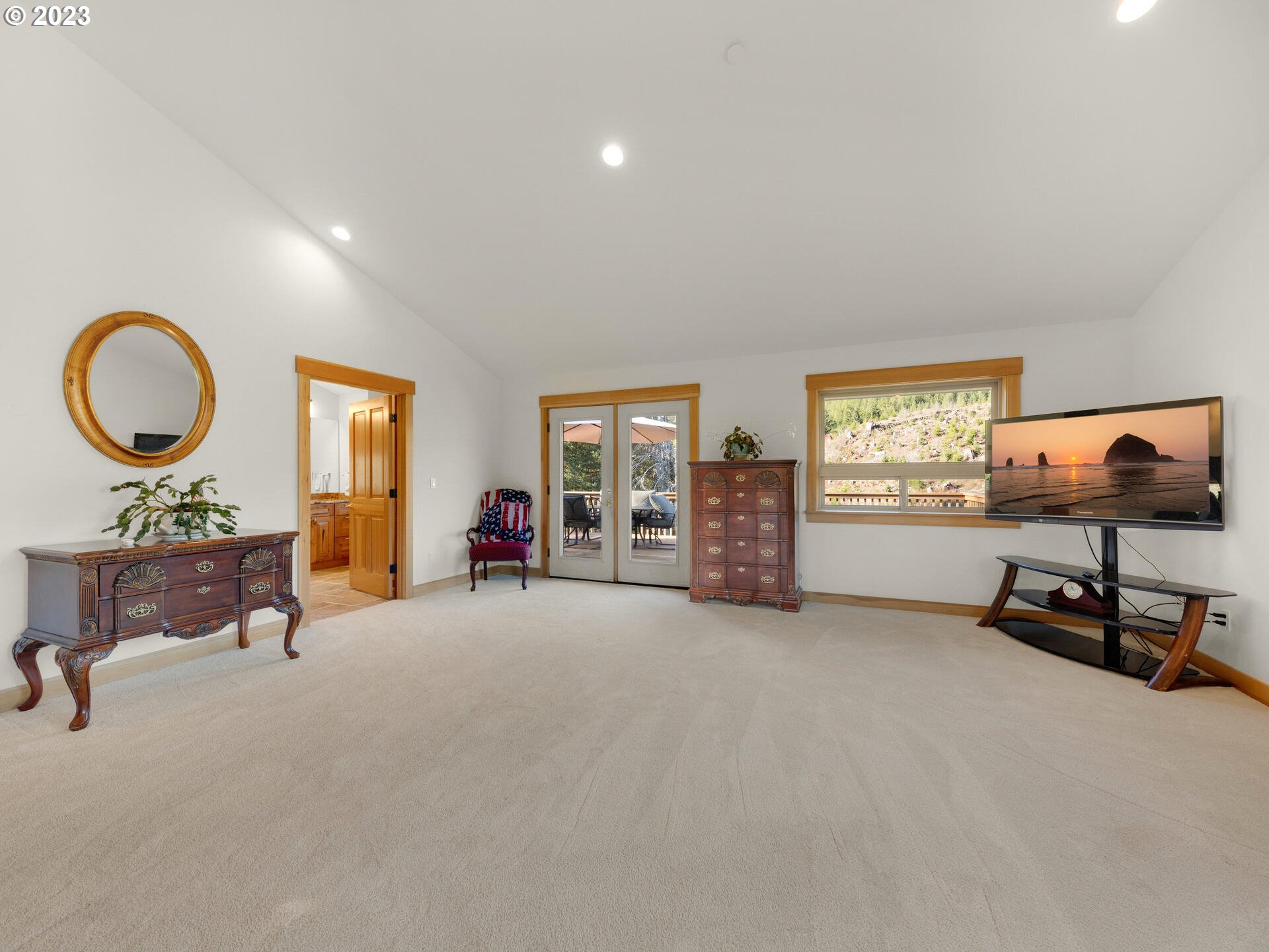 37769 Sunset Highway Seaside, OR 97138 - Photo 16 of 48 a living room with furniture and a flat screen tv