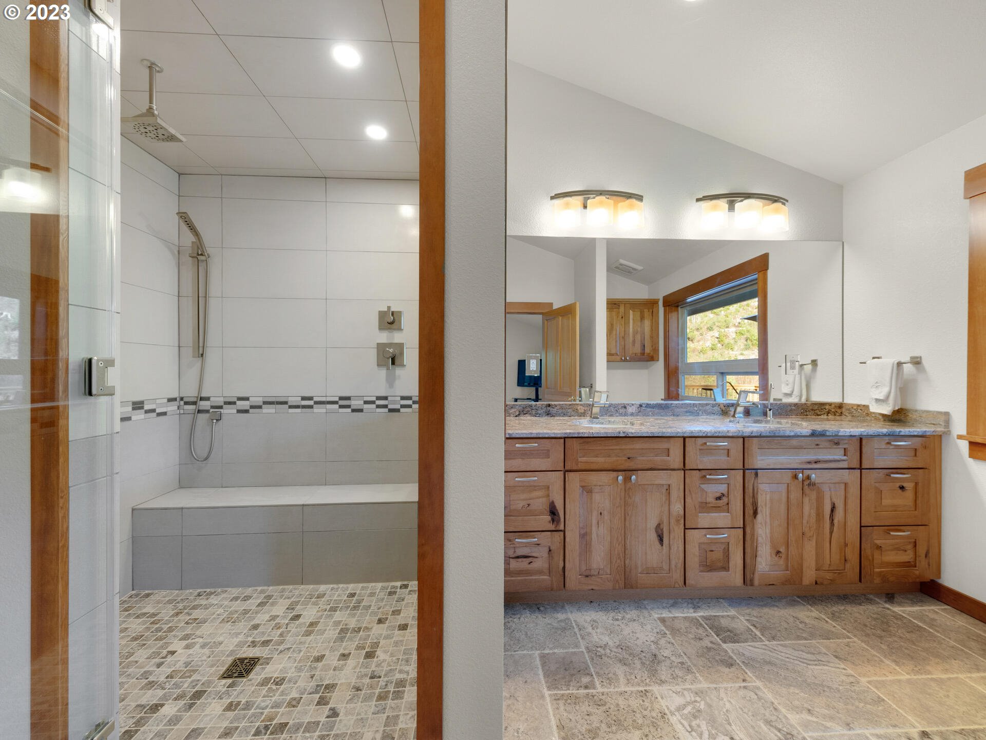 37769 Sunset Highway Seaside, OR 97138 - Photo 17 of 48 a bathroom with a granite countertop sink a mirror and a bathtub