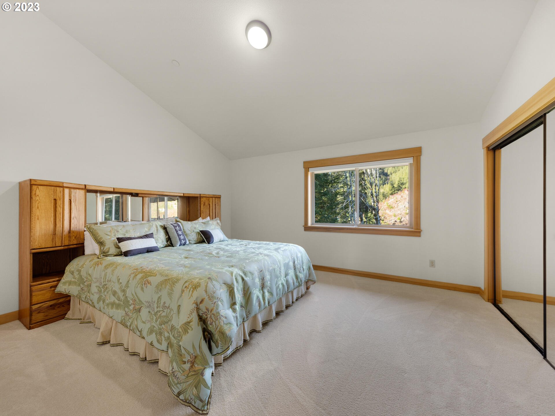 37769 Sunset Highway Seaside, OR 97138 - Photo 26 of 48 a bedroom with two beds and a window