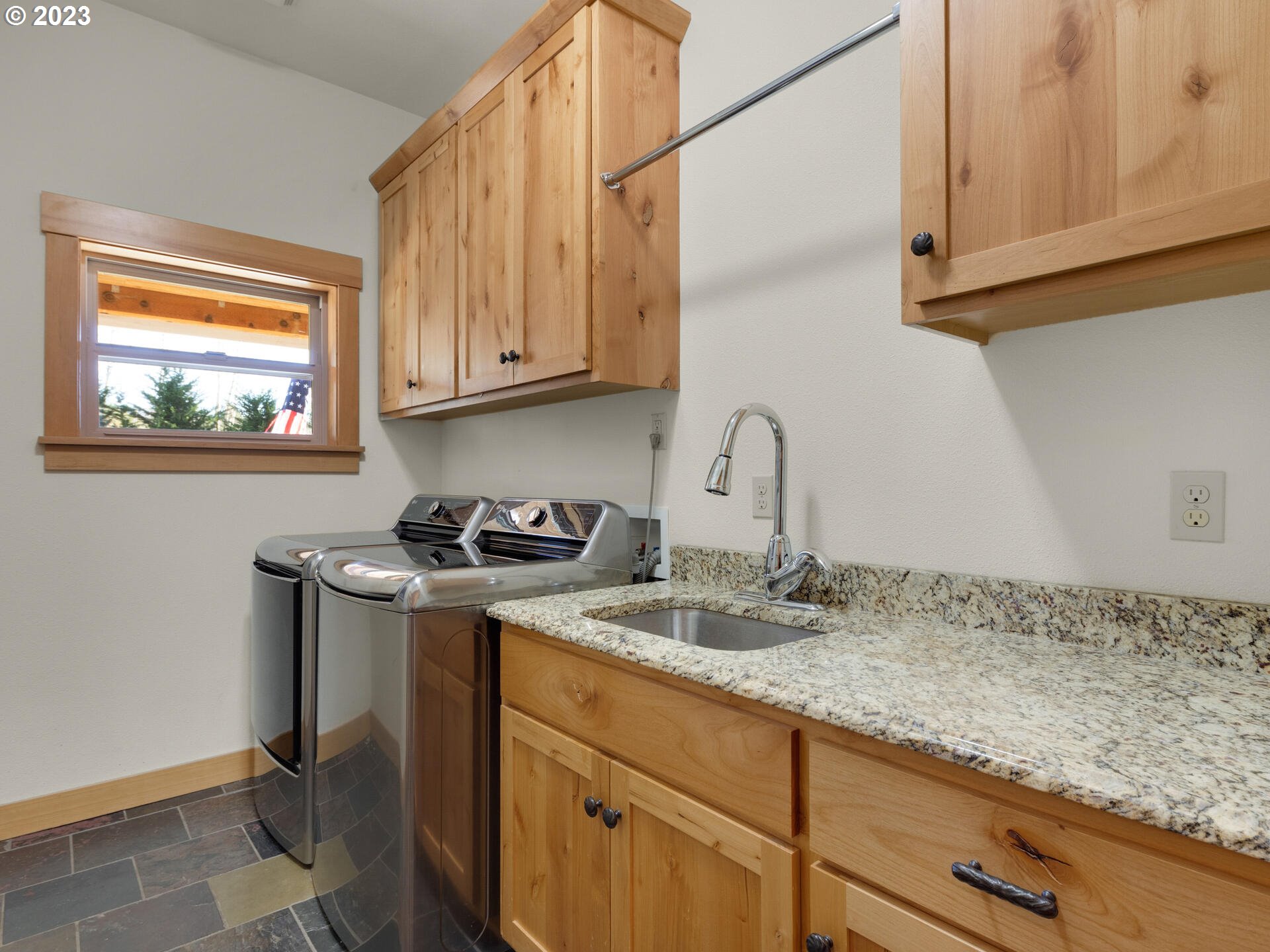 37769 Sunset Highway Seaside, OR 97138 - Photo 33 of 48 a kitchen with stainless steel appliances granite countertop a sink stove and cabinets