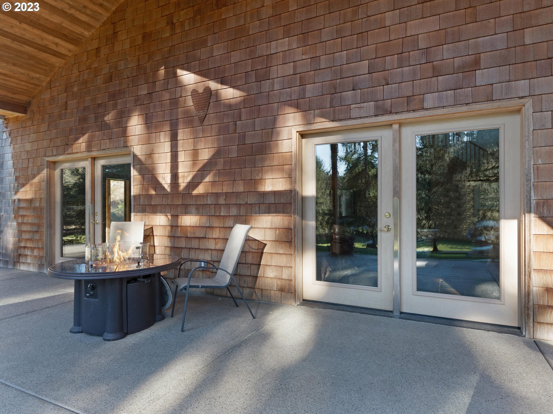 37769 Sunset Highway Seaside, OR 97138 - Photo 35 of 48 a view of a patio with a table and chairs