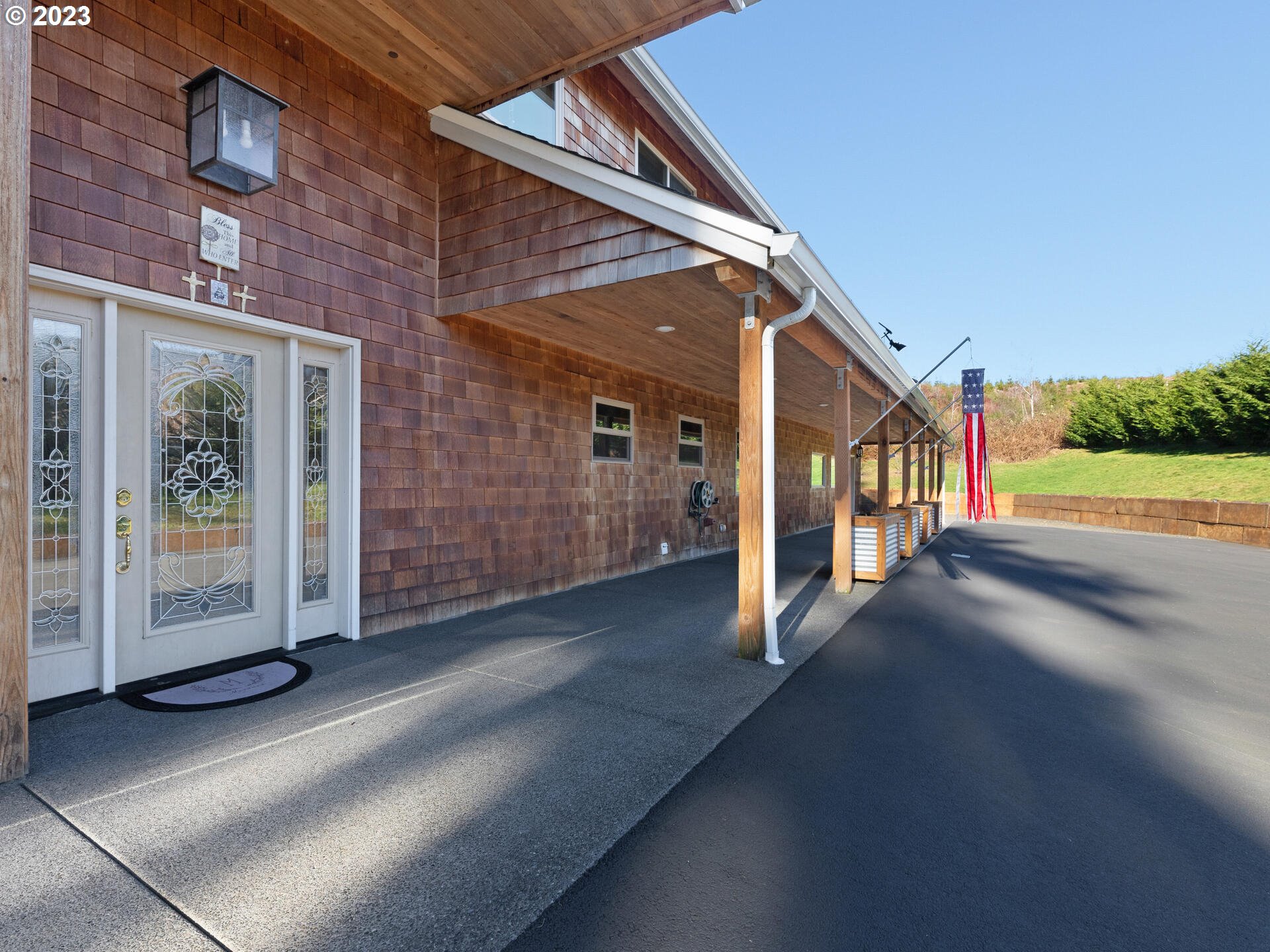 37769 Sunset Highway Seaside, OR 97138 - Photo 42 of 48 a view of a porch with furniture and a yard