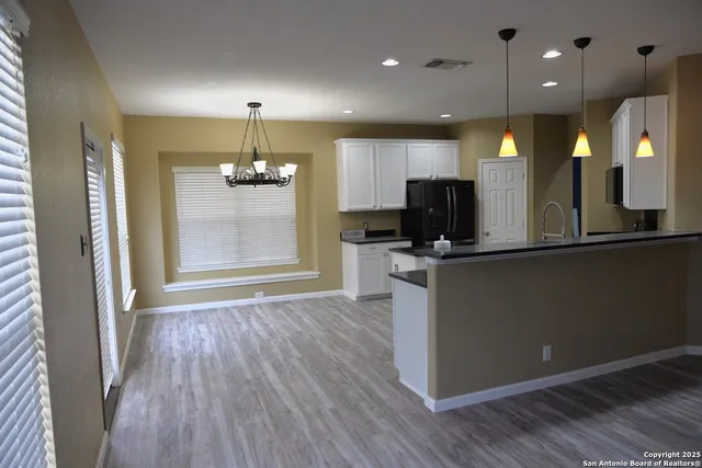 a view of a kitchen with microwave and stove