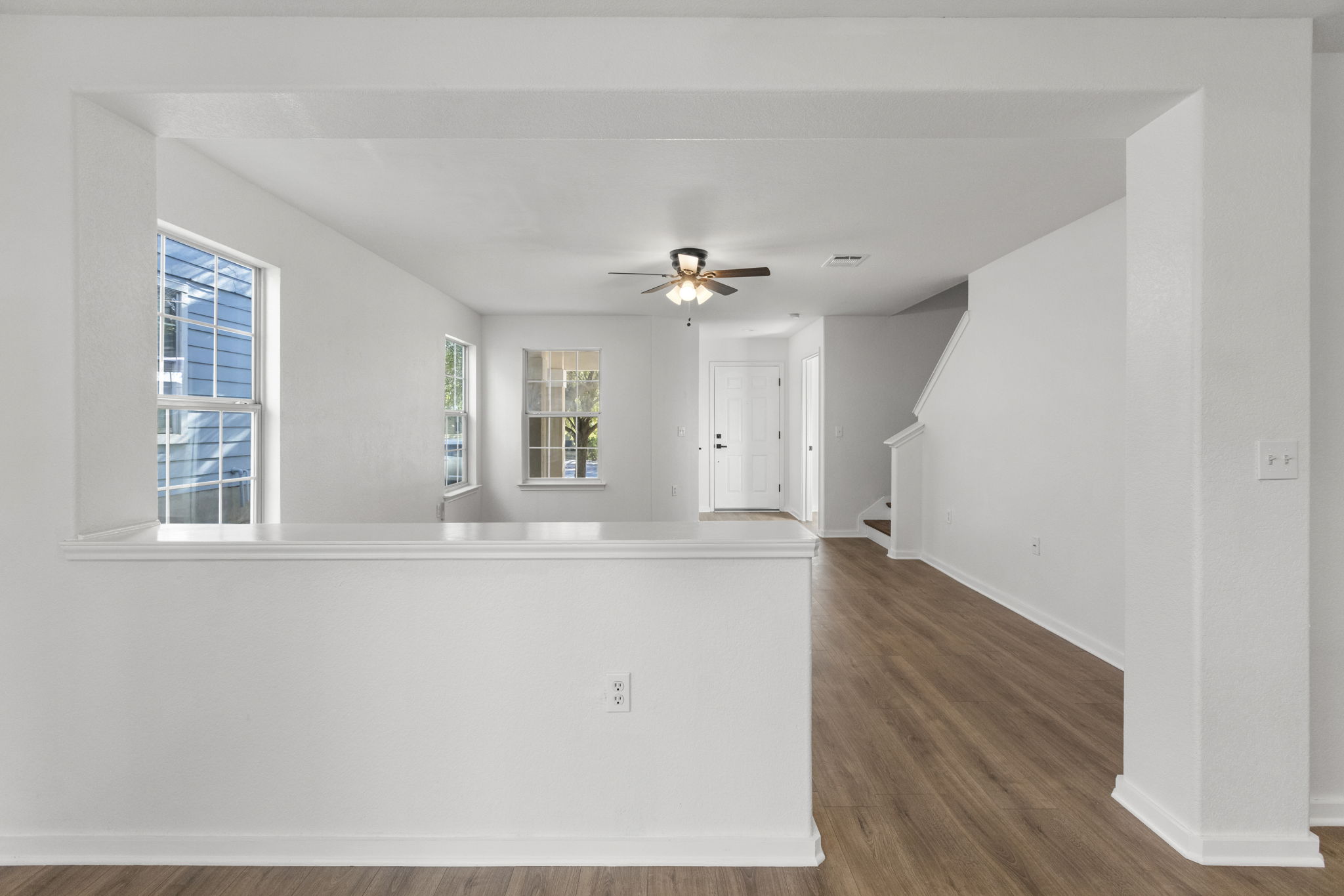 2110 Nogales Trail Austin, TX 78744 - Photo 10 of 37 wooden floor in an empty room with a window