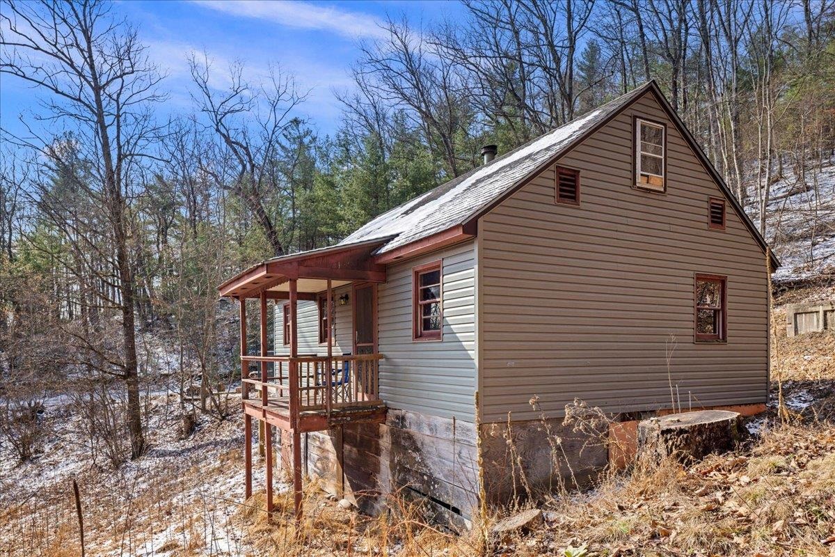 440 Clemmer Ridge Lane West Augusta, VA 24485 - Photo 6 of 39 a front view of house with yard and trees in the background