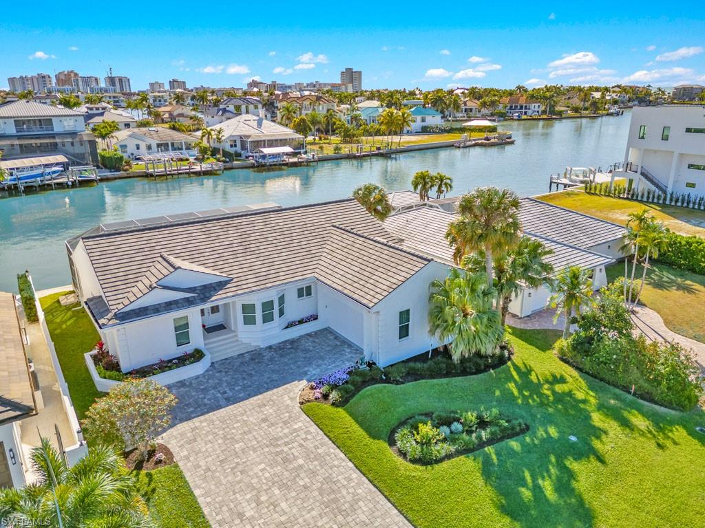 396 Conners Avenue Naples, FL 34108 - Photo 2 of 27 an aerial view of a house with lake view