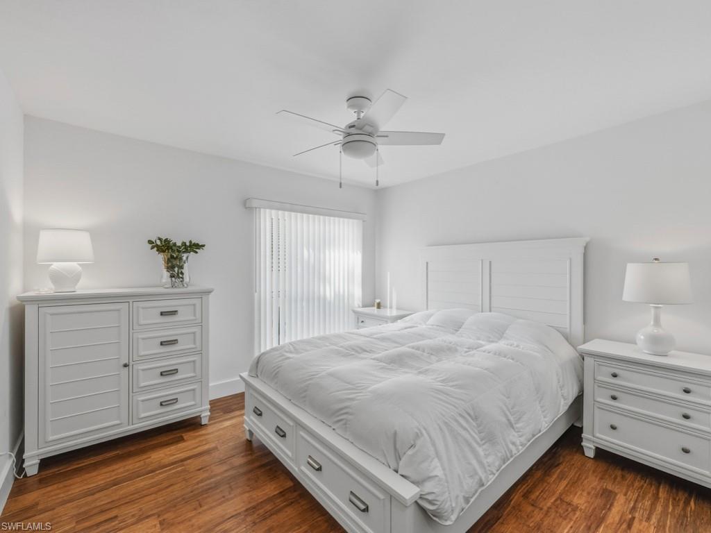 396 Conners Avenue Naples, FL 34108 - Photo 21 of 27 a bedroom with a bed and a dresser