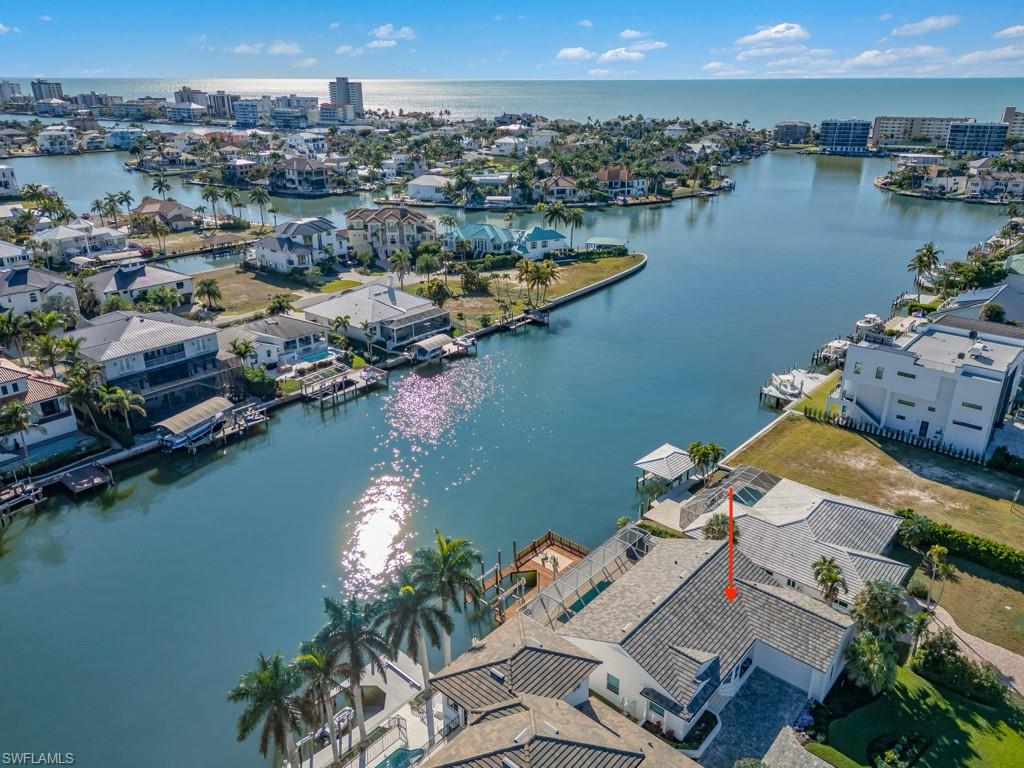 396 Conners Avenue Naples, FL 34108 - Photo 5 of 27 an aerial view of ocean and residential houses with outdoor space