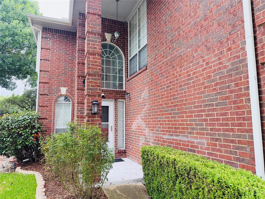 434 Moonlight Way Irving, TX 75063 - Photo 28 of 29 a brick building with a yard