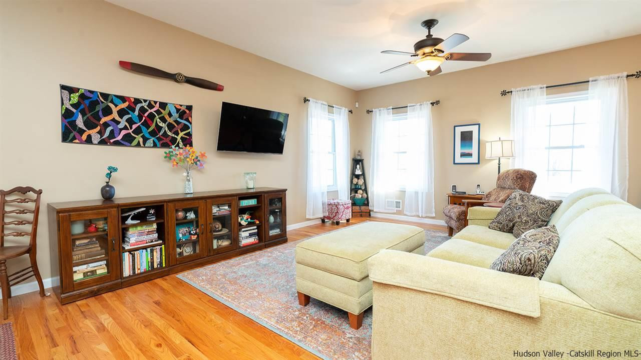 2108 Bruynswick Road Wallkill, NY 12589 - Photo 15 of 34 a living room with furniture a flat screen tv and a window