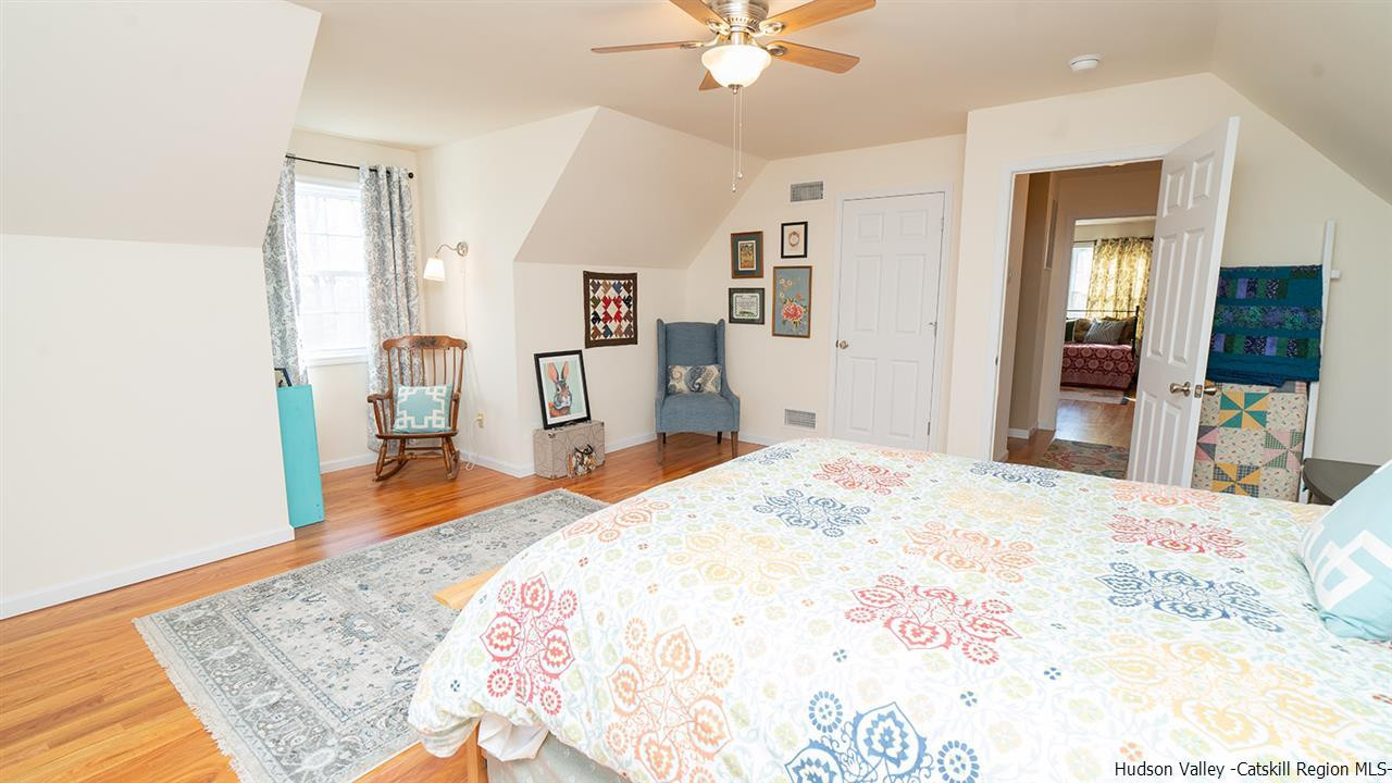 2108 Bruynswick Road Wallkill, NY 12589 - Photo 22 of 34 a bedroom with a bed and a dresser