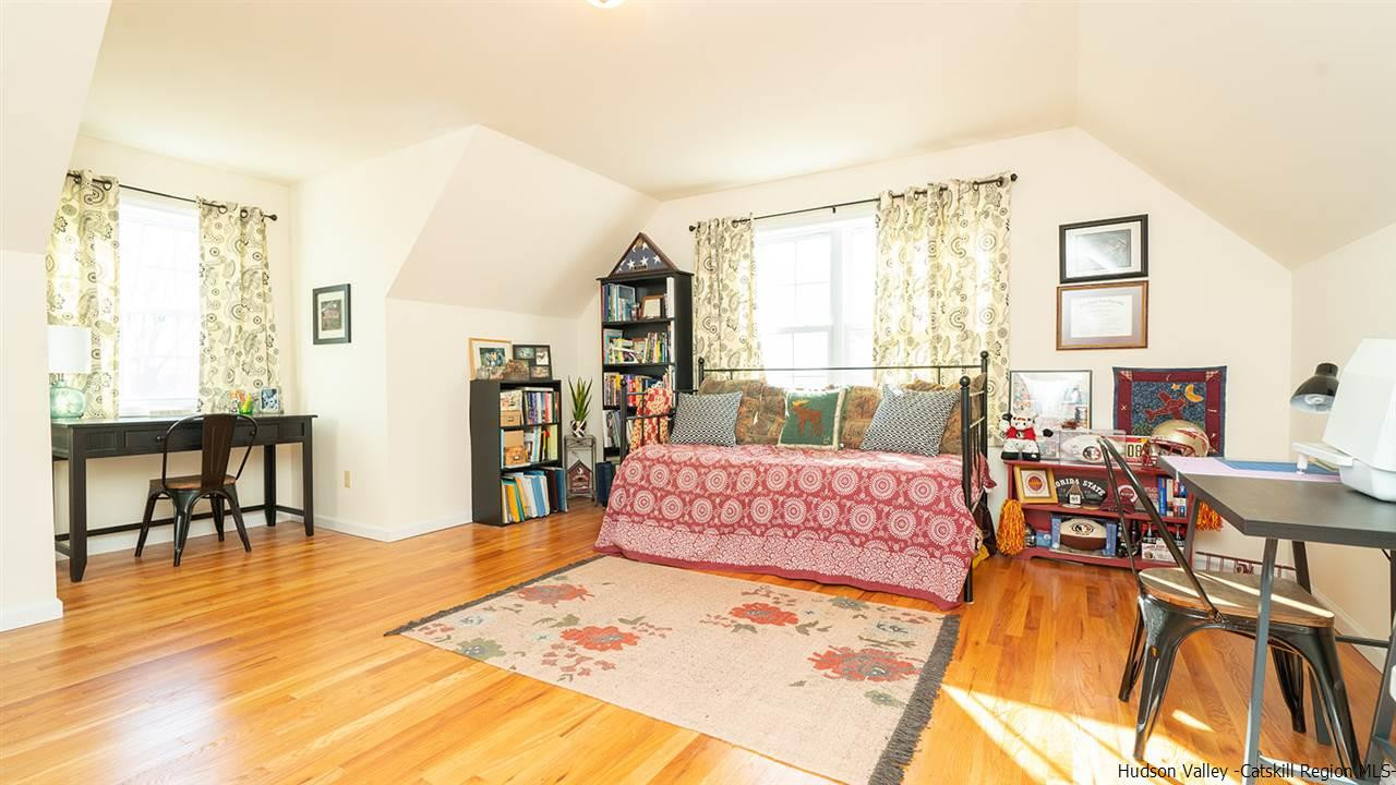 2108 Bruynswick Road Wallkill, NY 12589 - Photo 24 of 34 a bedroom with a bed and wooden floor