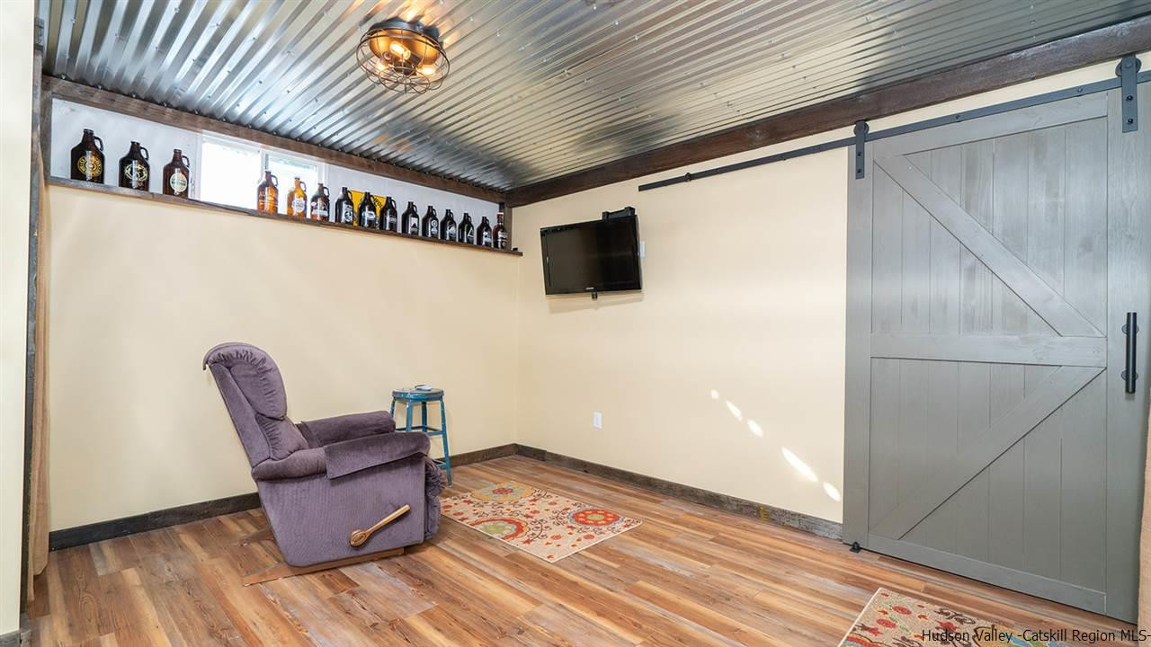 2108 Bruynswick Road Wallkill, NY 12589 - Photo 27 of 34 a living room with furniture and a flat screen tv