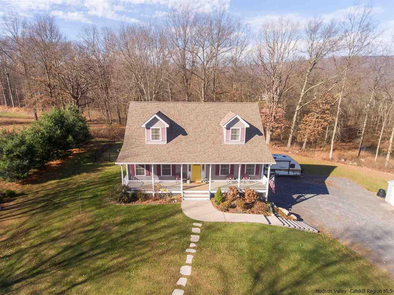 2108 Bruynswick Road Wallkill, NY 12589 - Photo 31 of 34 a view of a house with a yard patio and sitting area