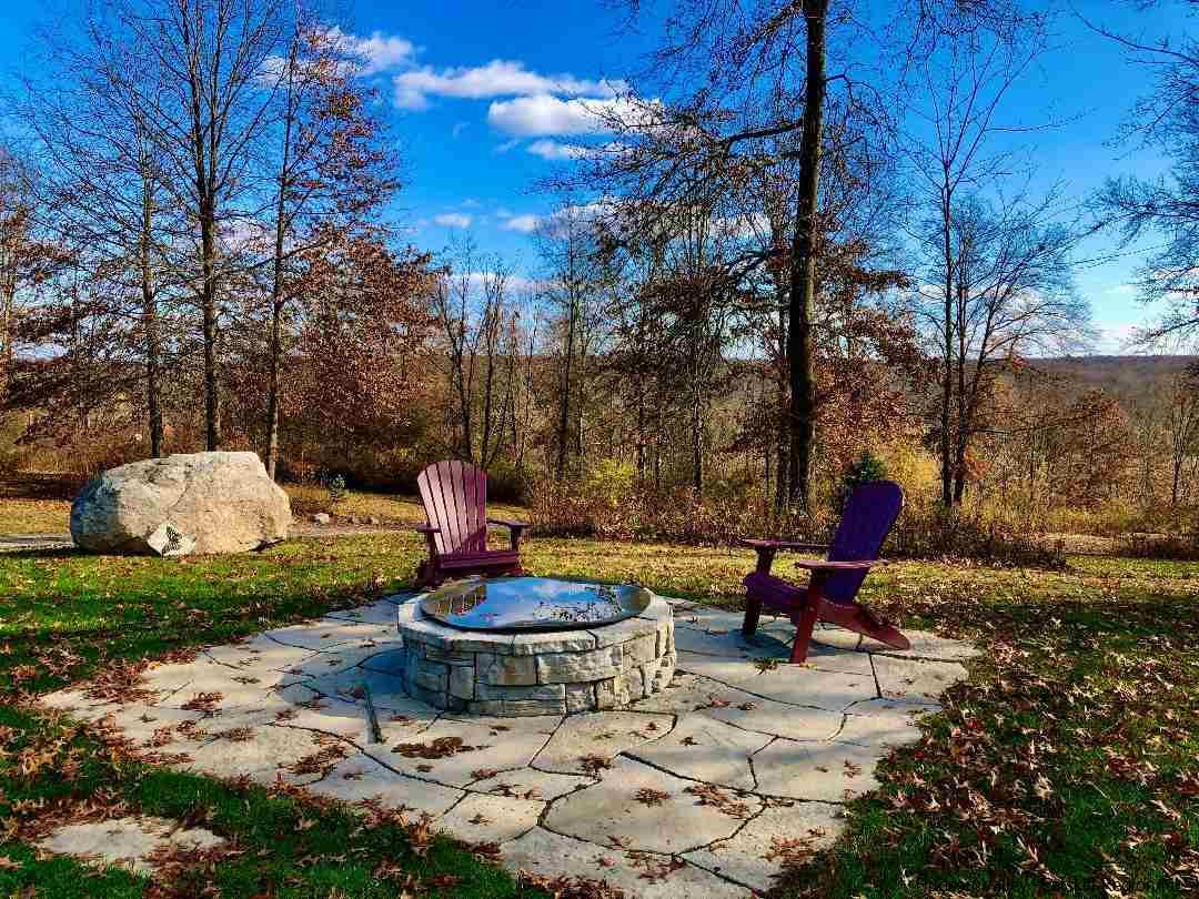 2108 Bruynswick Road Wallkill, NY 12589 - Photo 7 of 34 a backyard of a house with fountain table and chairs