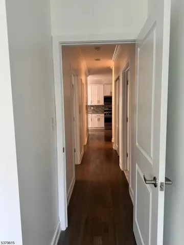 a view of a hallway with a furniture