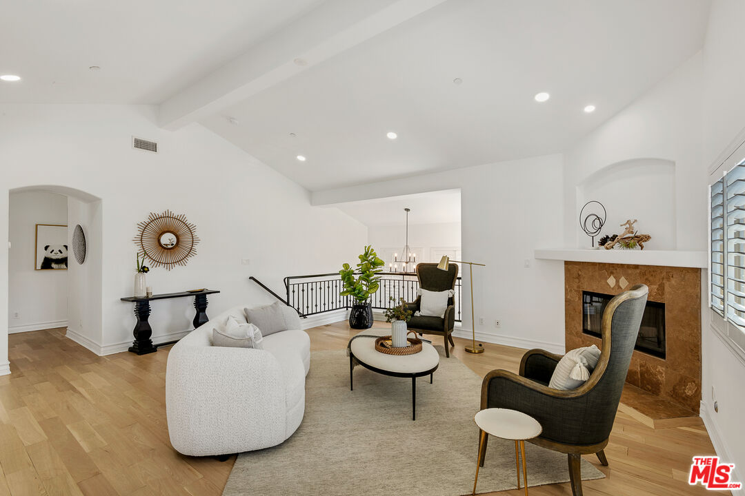 2005 Carnegie Lane, Unit A Redondo Beach, CA 90278 - Photo 1 of 25 a living room with furniture and a fireplace