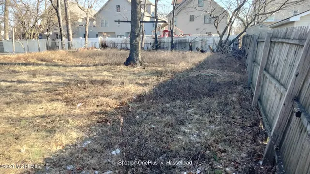 a view of a yard covered in snow