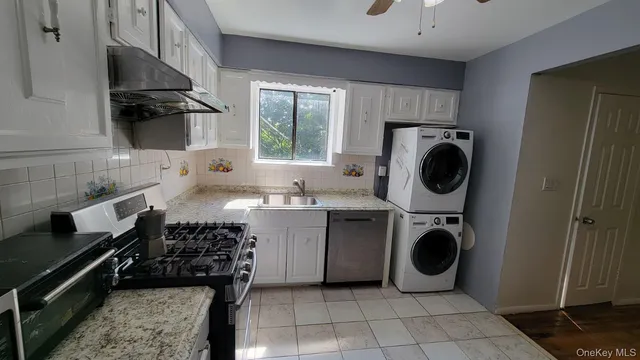 a kitchen with a stove and a refrigerator