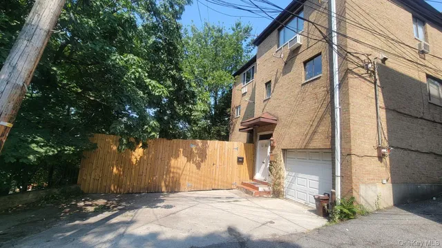 a view of a house with a tree